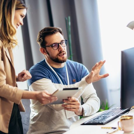 Young,Couple,Doing,Business,Together,Working,At,Home,On,The